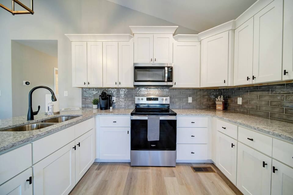 Spacious kitchen with plenty of room to cook a great meal and seating for 4 at the bar