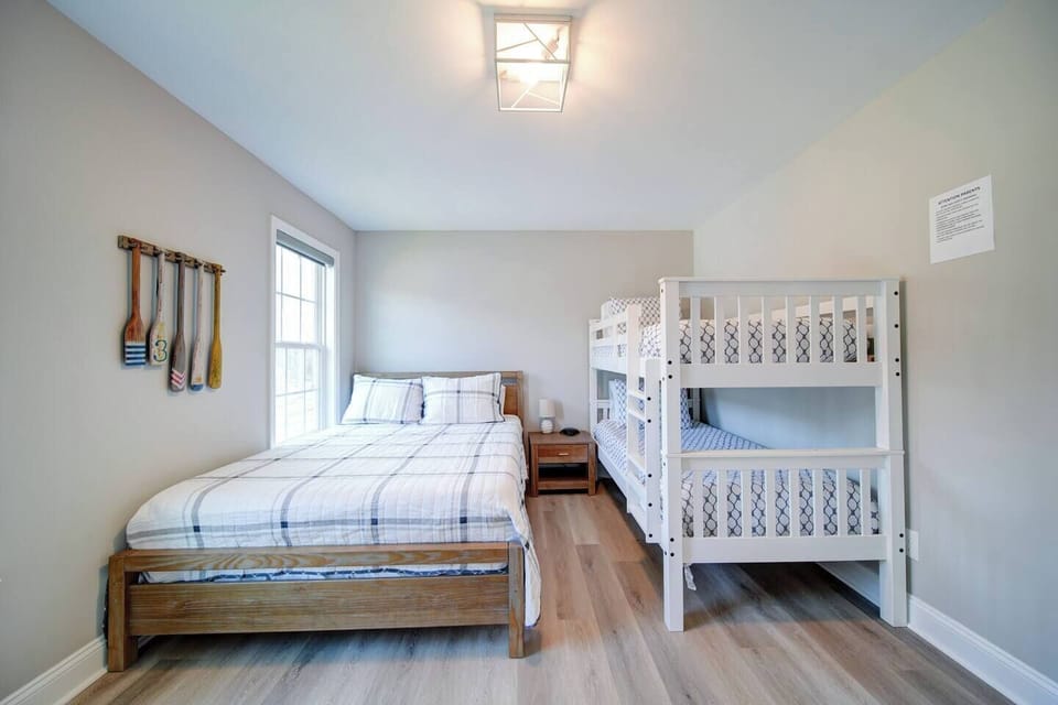 2nd bedroom sleeps 4 people with queen bed and twin bunk bed