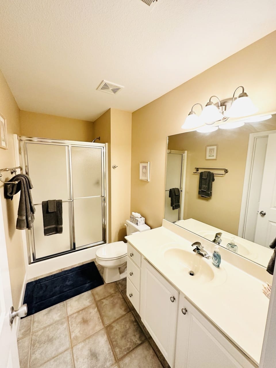 Upstairs Bath with entry to hallway and Upstairs Suite 1



