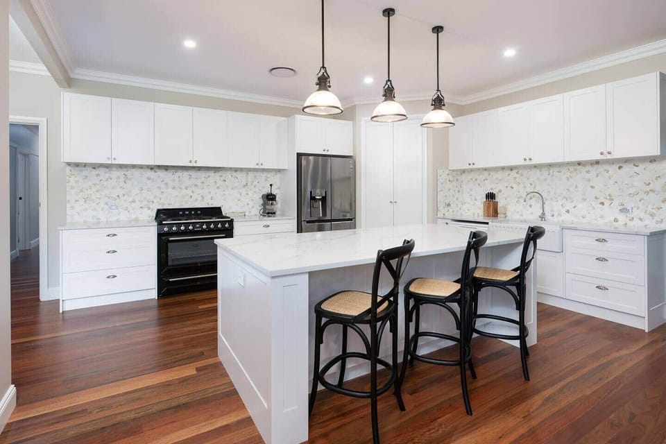 The kitchen includes fidge with plumbed in water and ice, dishwasher, and coffee machine.