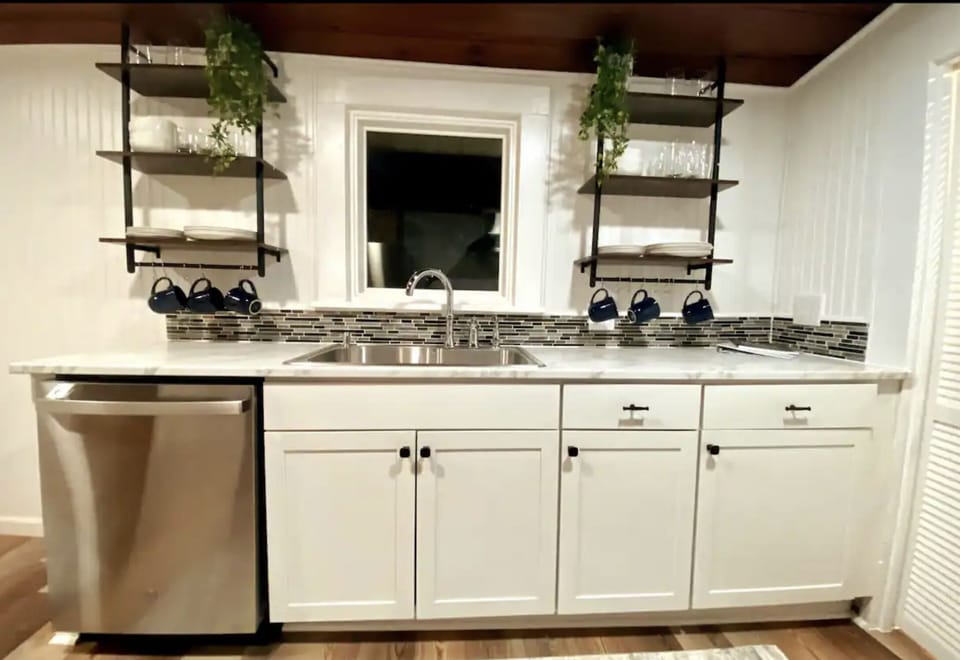 Sink wall of the kitchen. Pantry to the right and breakfast nook to the left 
