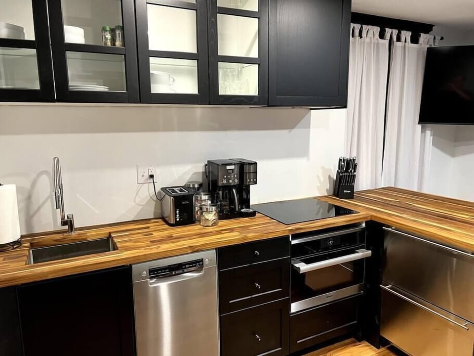 Kitchen comes equipped with Bosch dishwasher, Miele speedoven, induction cooktop, and undercounted fridge/freezer.  