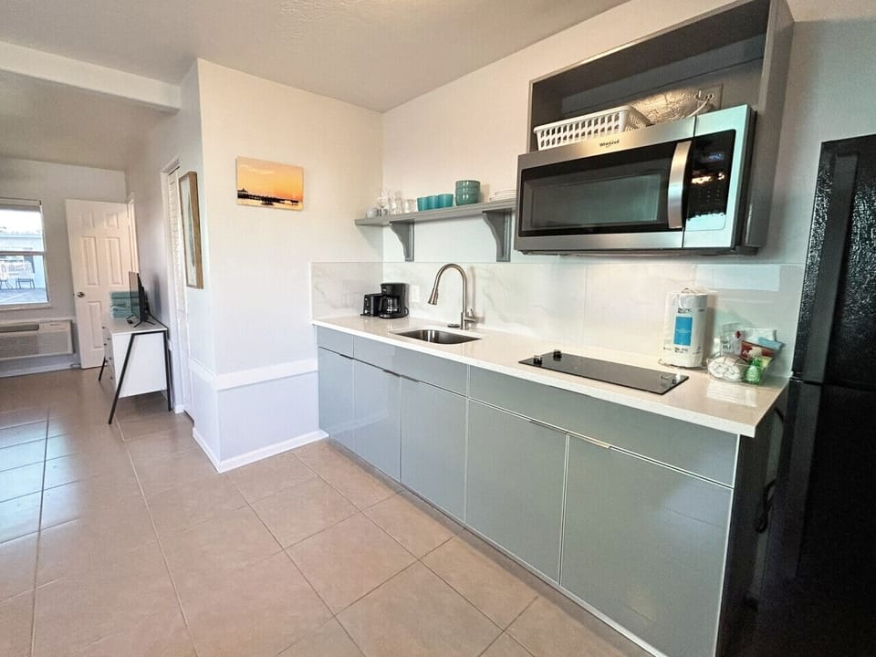 Contemporary kitchen area offering high-end appliances for guest use.