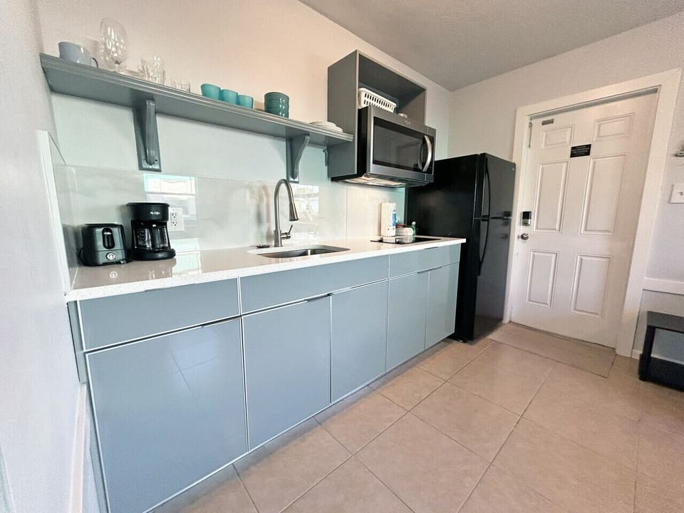 Sleek kitchen space offering convenient cooking tools for guests.