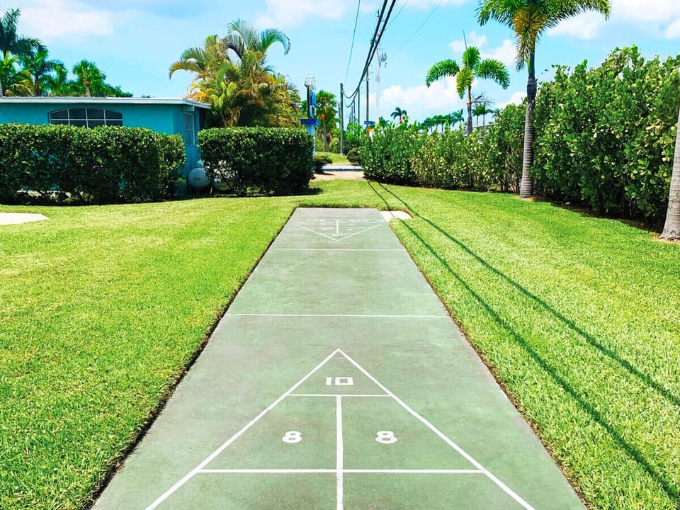 Full shuffleboard facilities offering a classic Florida lawn game experience.