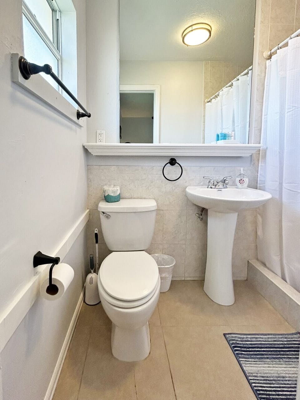 Functional bathroom space offering a modern vanity and shower.