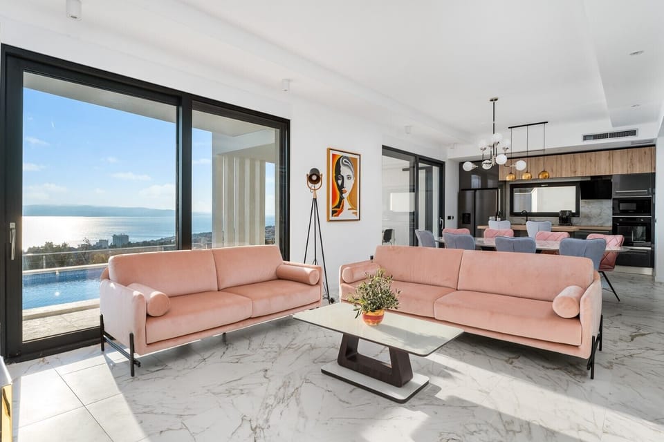The Ground floor offers an open-plan living area with a flat-screen TV, a Party box speaker, and free WiFi.