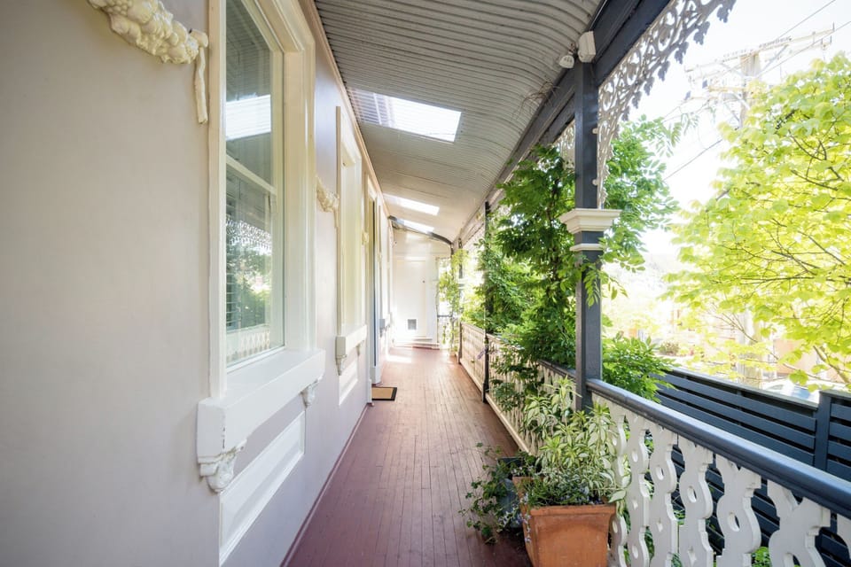 A sun-drenched, spacious veranda wrapping around the exterior of the home