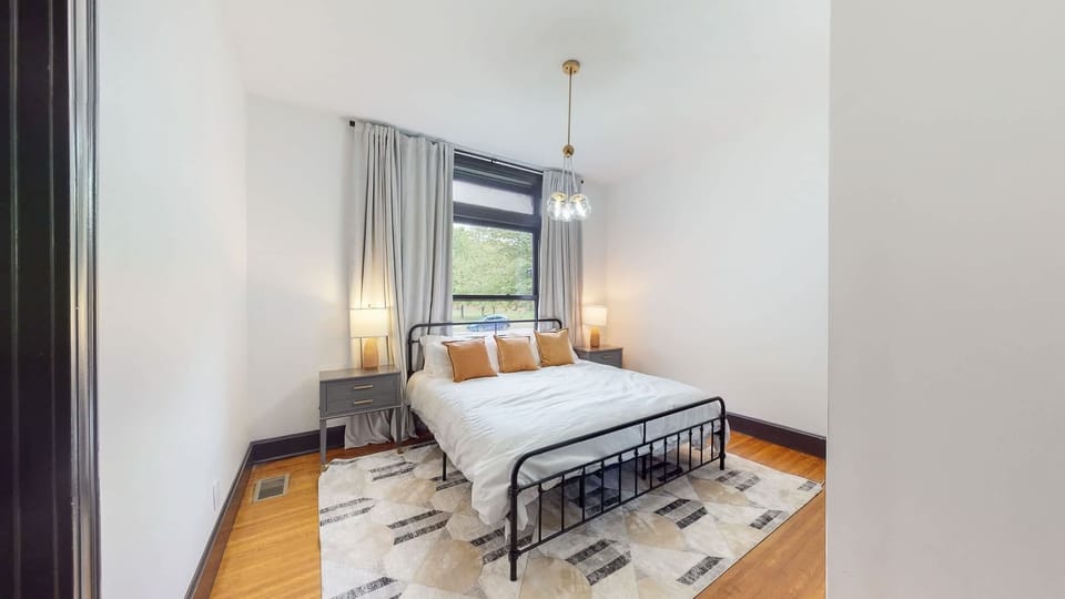 Bedroom 1: You'll love the big window with thick curtains – great for sunny days or nighttime privacy.