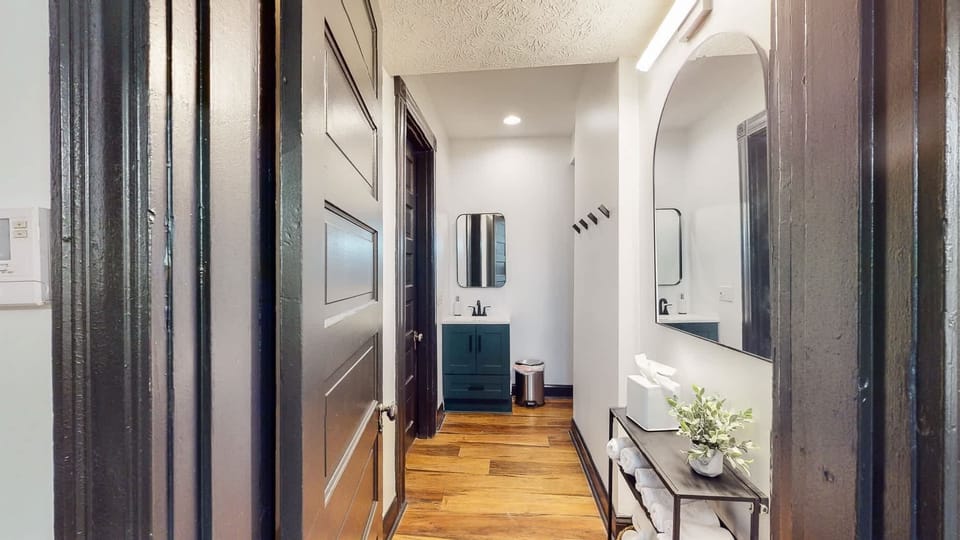 Full Bathroom: You'll find a large mirror placed atop the console table, for you to quickly check yourself and do touch-ups before you head out.