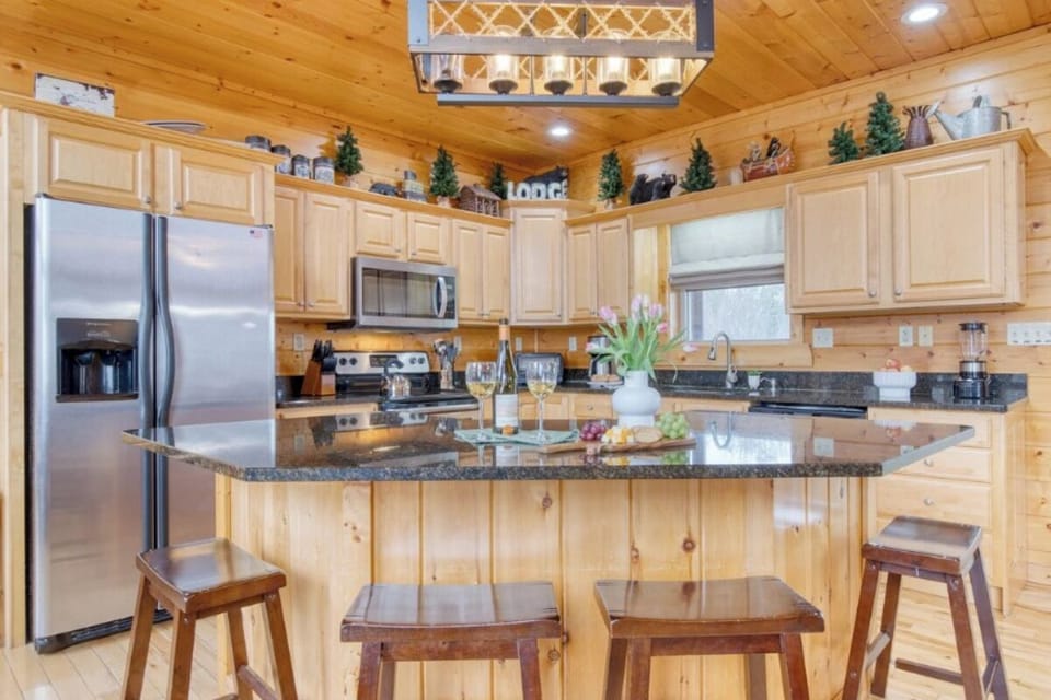 Your fully equipped kitchen awaits with granite countertops, stainless appliances, and rustic charm for memorable meals together.