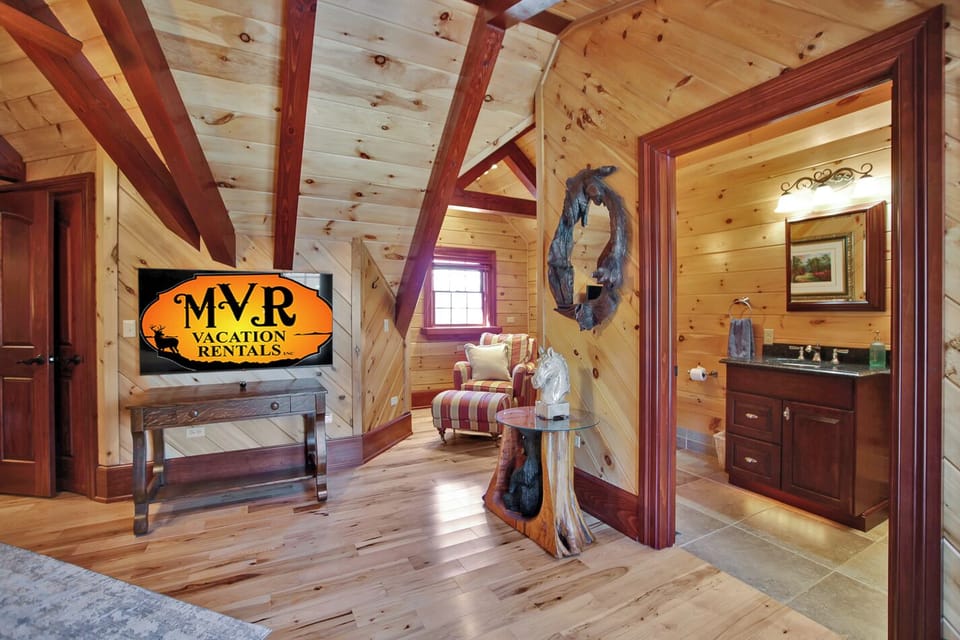 King bedroom suite on 2nd floor. Sitting area and bathroom with walk-in shower and Juliet balcony.