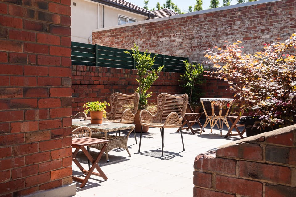 A quiet terrace, reached a few steps from the bedroom.