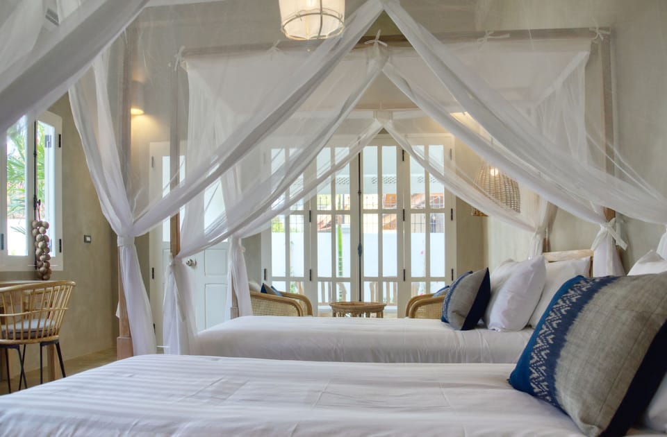 Junior Twin Room, 2 Bedrooms, Non Smoking, Garden View | Minibar, in-room safe, individually decorated, desk
