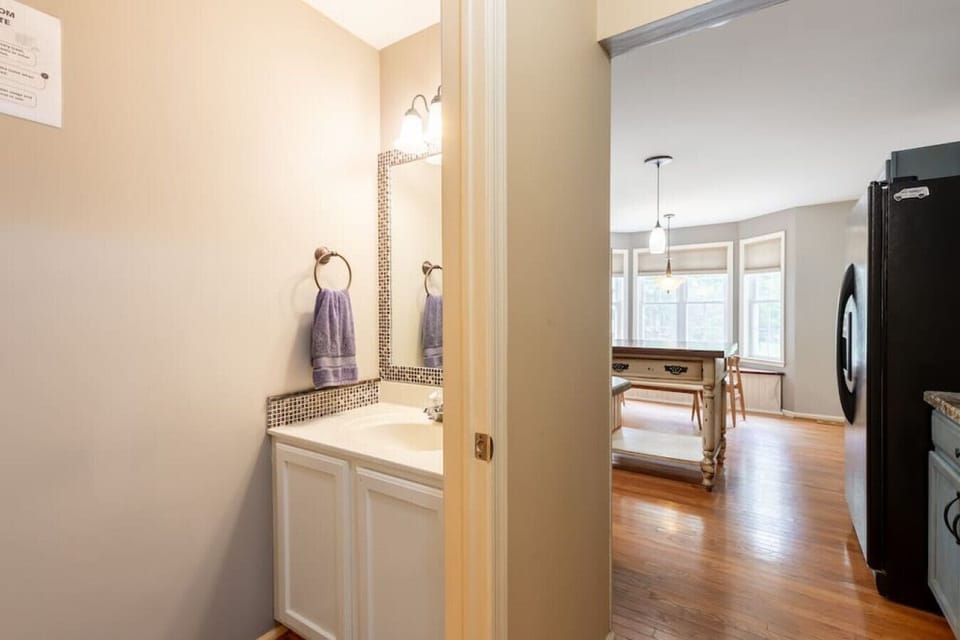 Modern powder room beside the open kitchen, ideal for guests and easy everyday access