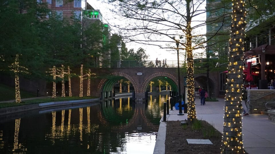 `Stroll into the evening lights: As the day ends, the magic begins on The Woodlands Waterway. This idyllic spot offers the perfect blend of peaceful water views and vibrant nightlife. Come discover your slice of enchantment. #EveningStrolls #WaterwayNight