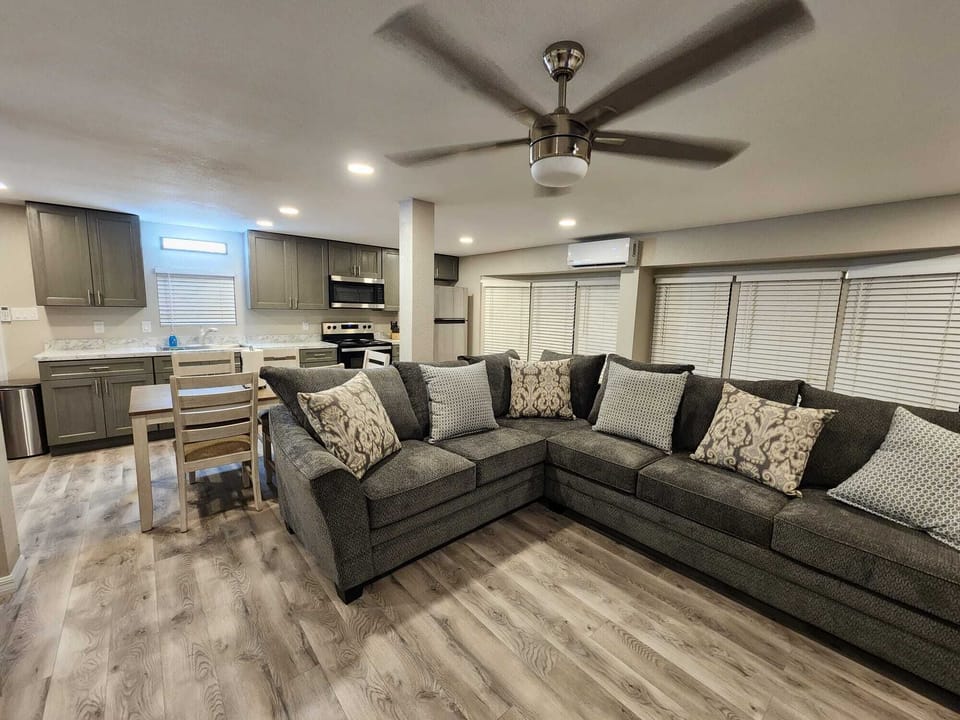 sofa, dinette and well stocked  kitchen. 