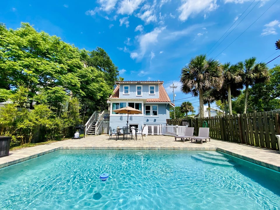 View of private courtyard, pool and main cottage