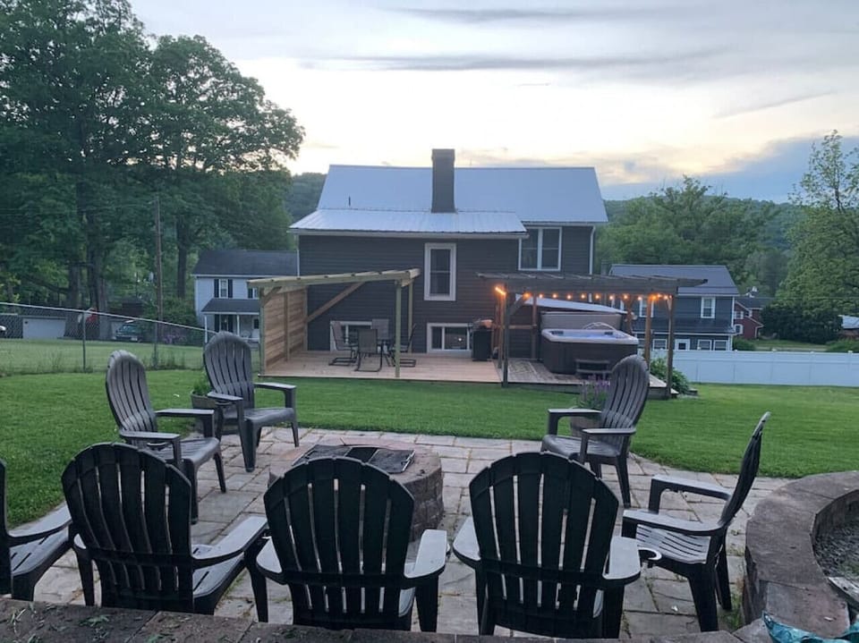 Backyard with fire pit, pool and hot tub