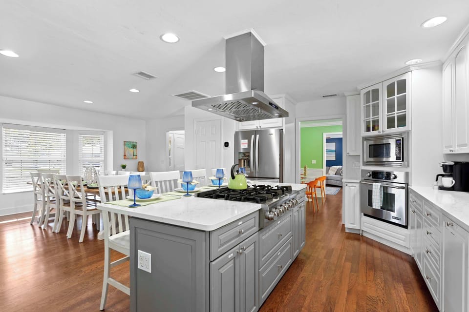 Kitchen & Dining: Open layout connects the fully equipped kitchen to the dining area — perfect for group meals.