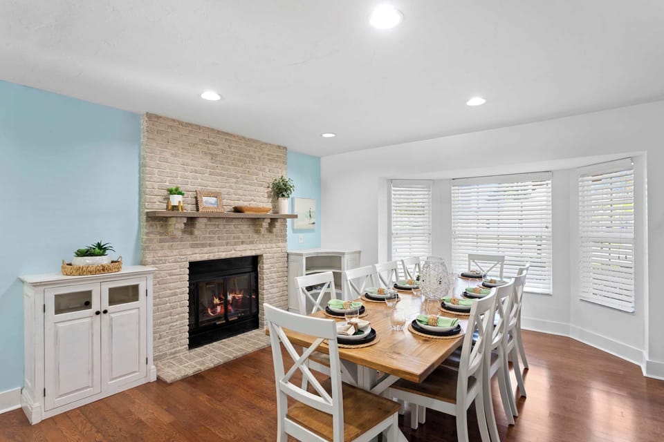Dining Room: Gather around a charming table for unforgettable meals by the cozy fireplace!
