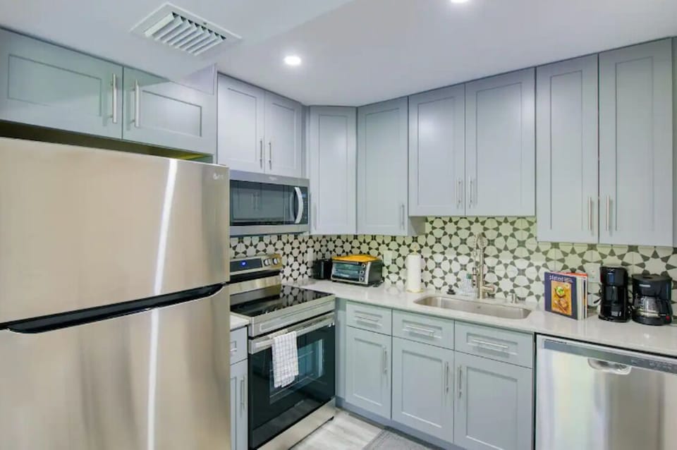 Fully equipped kitchen—stainless steel, ample space, perfect for easy meals