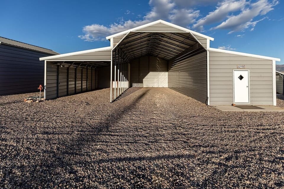 Covered parking sheds that should easily fit your truck and trailer. 30 and 40 feet deep.