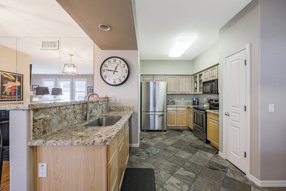 Fully-equipped kitchen with filtered drinking water, dishwasher, refrigerator, freezer with ice maker, 4-burner stovetop, microwave, oven and pantry.
