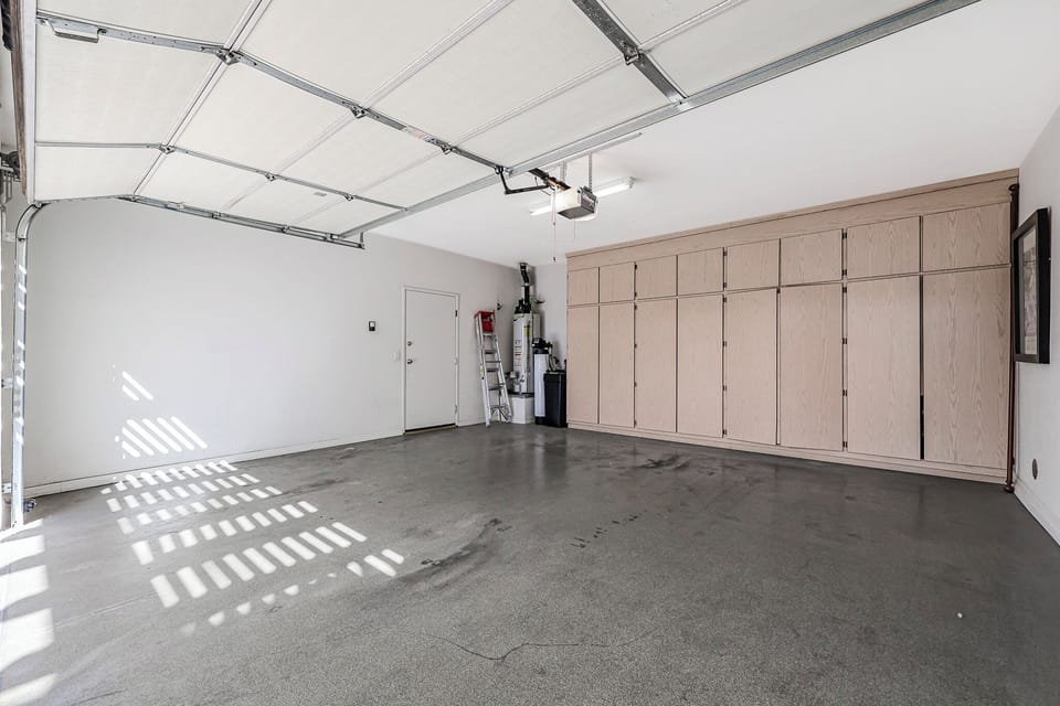 2-car garage with plenty of storage. **Standard length vehicles only. Longer vehicles such as XL versions or extended bed trucks will NOT fit.**