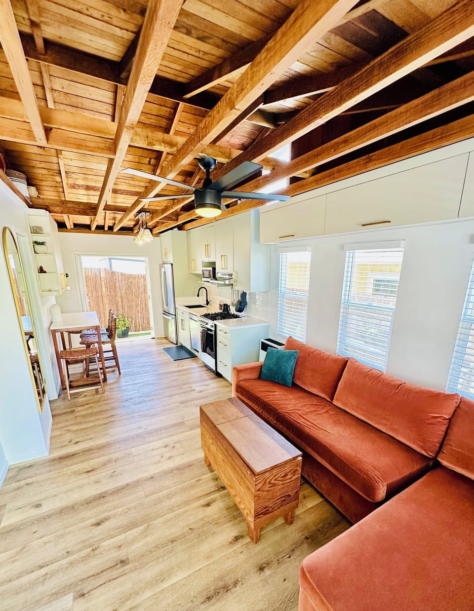 Open concept kitchen, dining room, and living room. Vaulted ceilings.