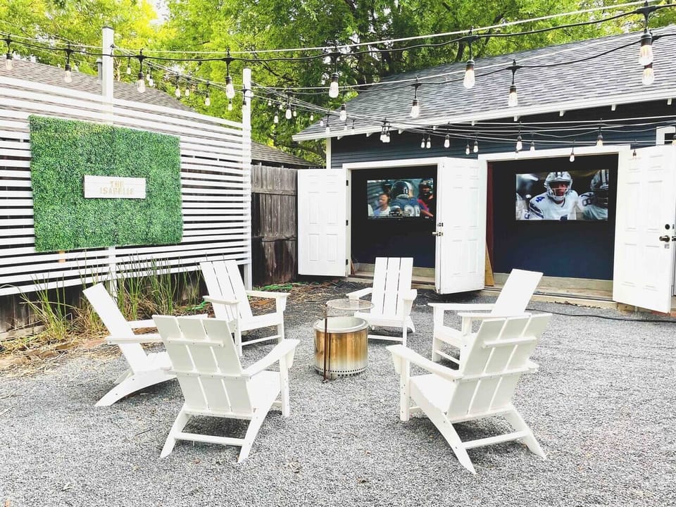 The Isabelle backyard is game day and movie night ready with two 60 inch high definition 4K smart Roku TVs.  