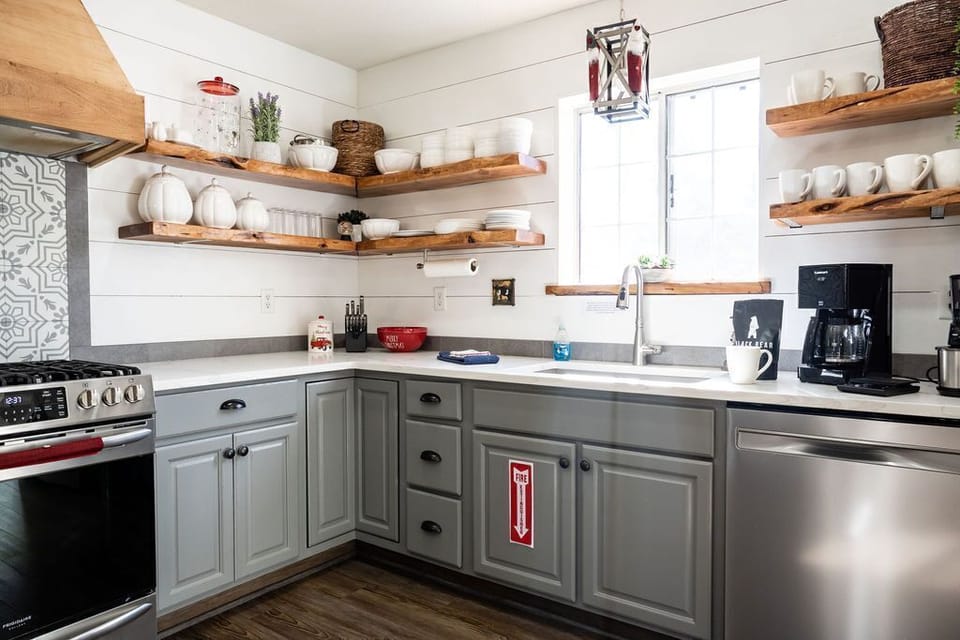 Floating shelves, HUGE farmhouse sink, and new knife set make food prep a breeze