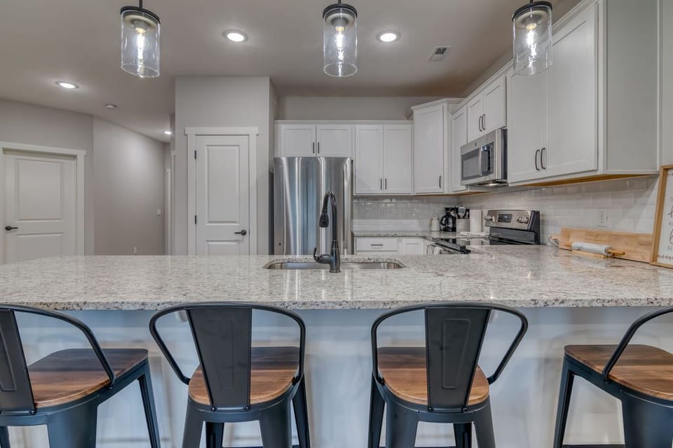 Stainless steal appliances, ample counter space, and plenty of seating