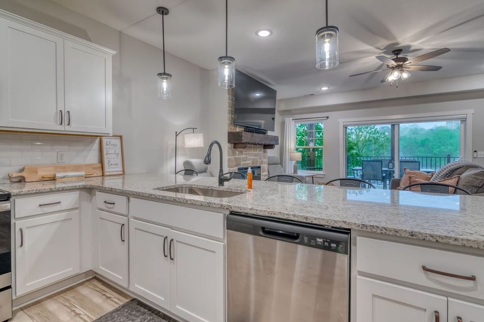 The kitchen is stocked with cookware, silverware, plates/cups, utensils, & more