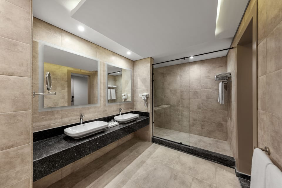 Shower, rainfall showerhead, designer toiletries, hair dryer
