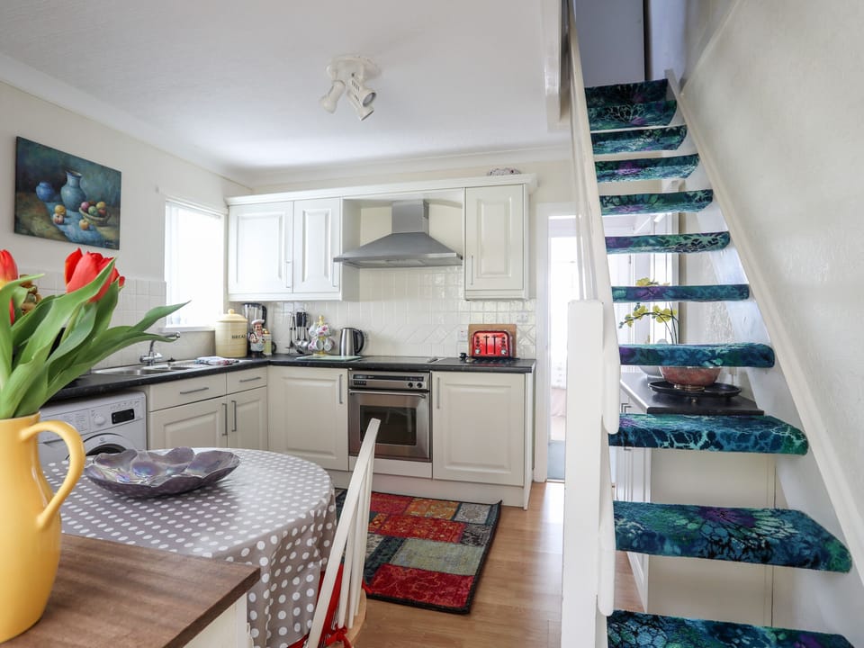 Fridge, electric kettle, toaster, cookware/dishes/utensils