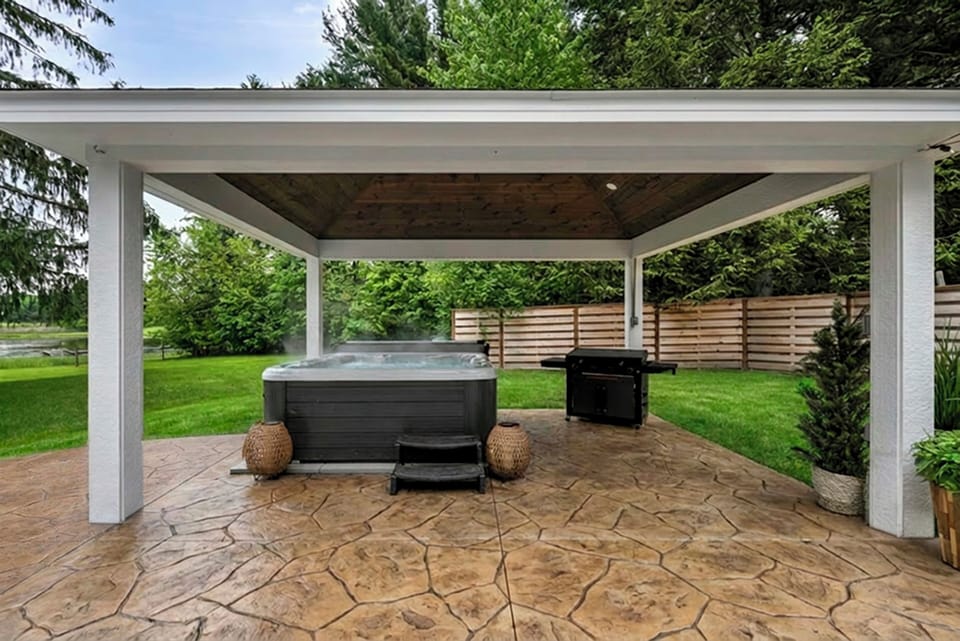 Hot tub: Experience the ultimate outdoor getaway with a private covered hot tub, spacious patio, BBQ griddle, and peaceful nature views. Perfect for family vacations, group retreats, and weekend escapes.