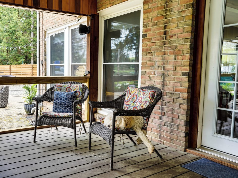 Quiet spot with comfy chairs to relax, sip coffee, or read while enjoying fresh air without the bugs.