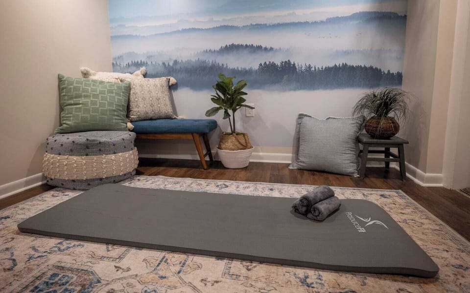 Yoga, Flex Room, with play area.  A room just to center yourself in calm by the landscape mural, with yoga mats, towels, and cards to guide you through your own personal rejuvenating session. 