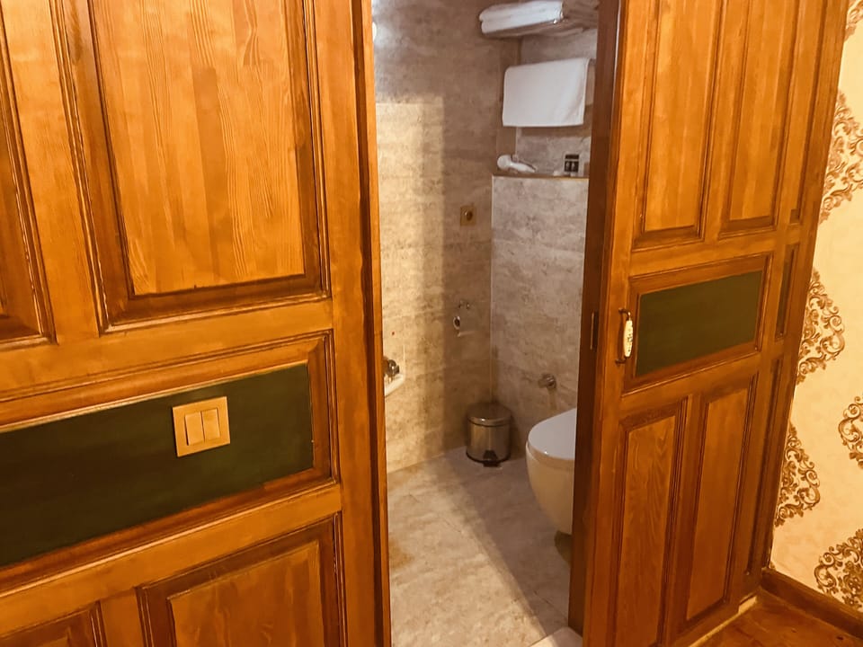 Shower, rainfall showerhead, hair dryer, towels