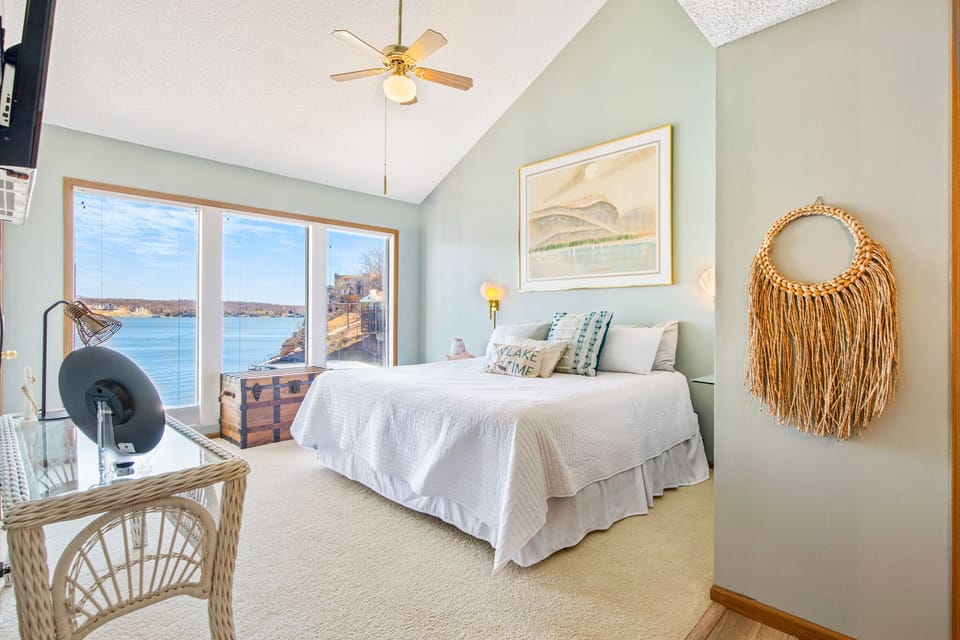 Wake up to lake with the wall of windows in your master bedroom.