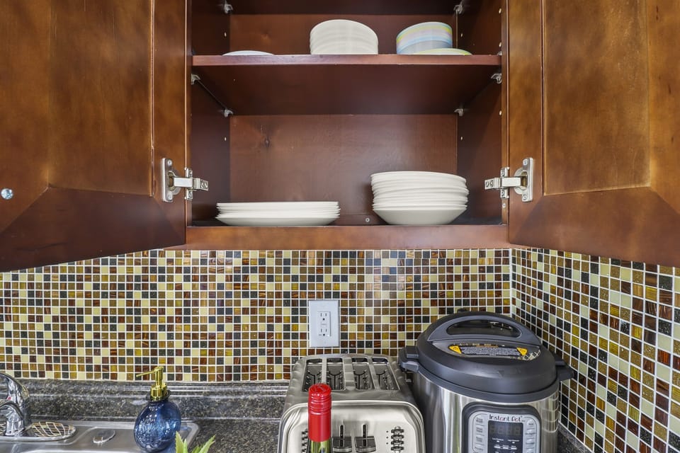 The plates are located in the cabinet just above the Instant Pot