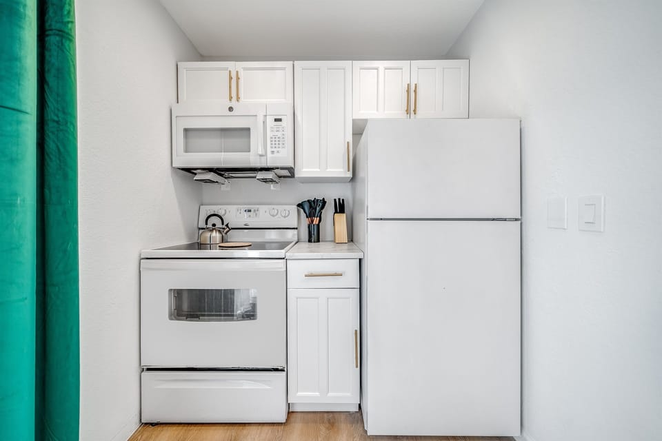 Kitchen comes with cook top stove, oven and fridge. We've provided the basics plus more