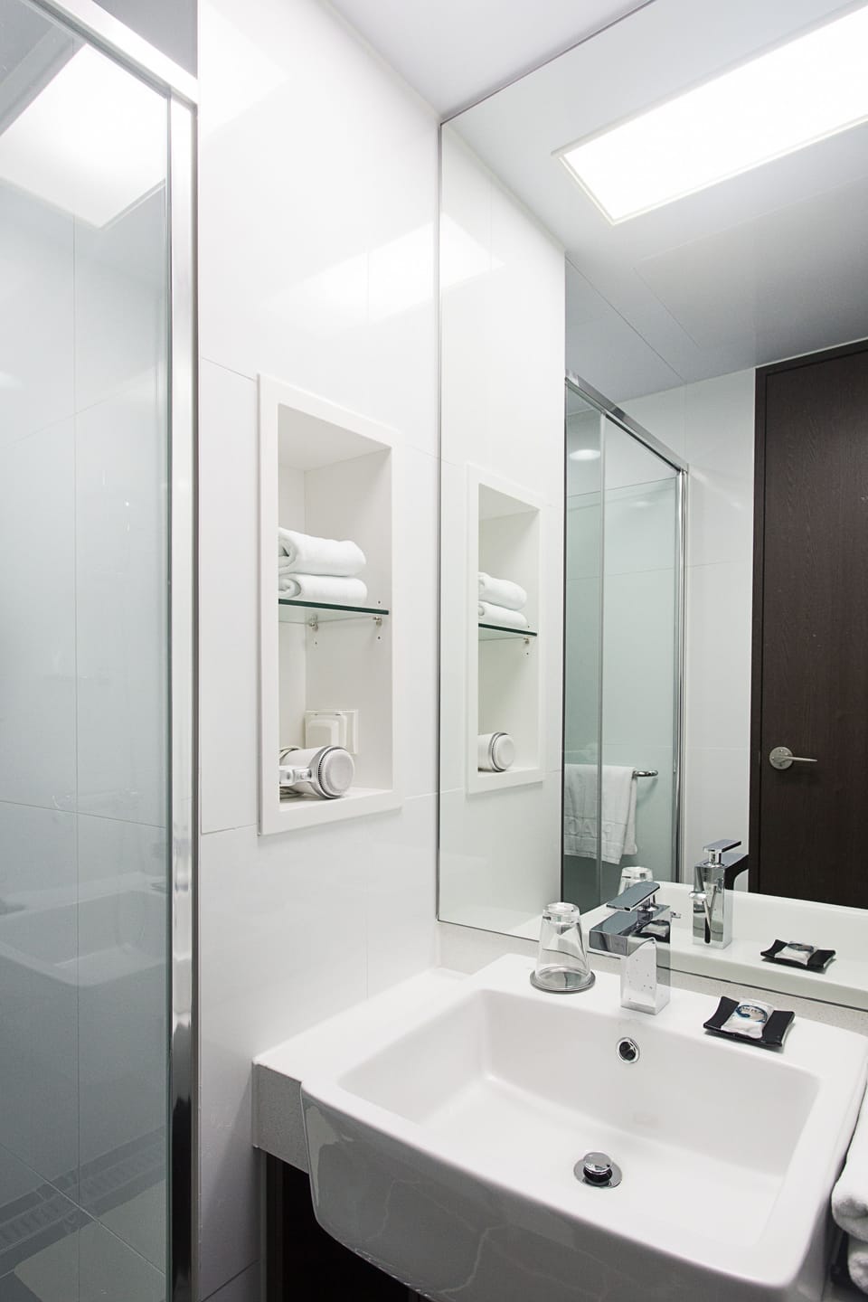 Shower, hair dryer, slippers, towels