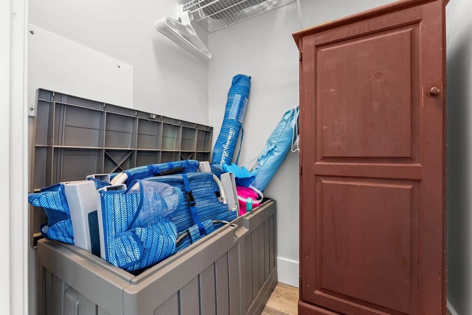 Tommy Bahama beach chairs and umbrella located in master closet