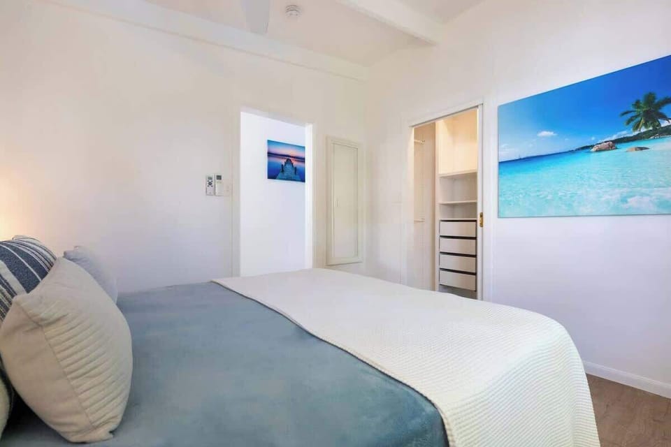 Rest easy in the chic bedroom with a queen bed and split-system cooling.