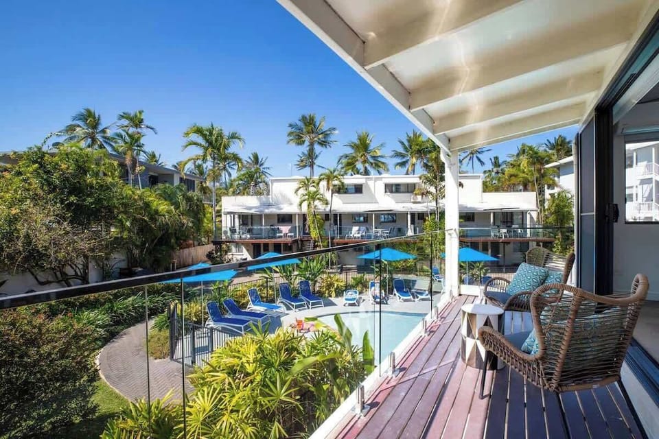 Make your way out to the private patio overlooking the pool, with arm chairs to sit and soak up the sun.
