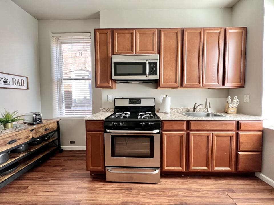Fully stocked kitchen with stainless steel appliances 