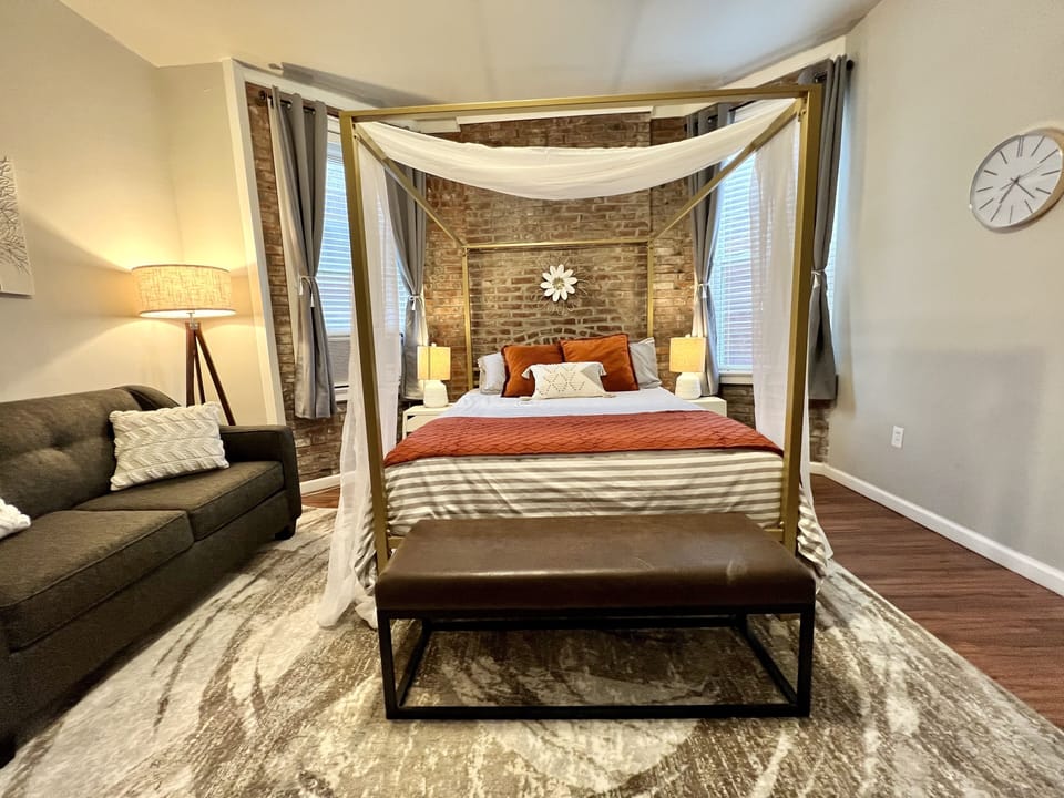 Cozy with plenty of natural light and blackout curtains. Bench seating at bed