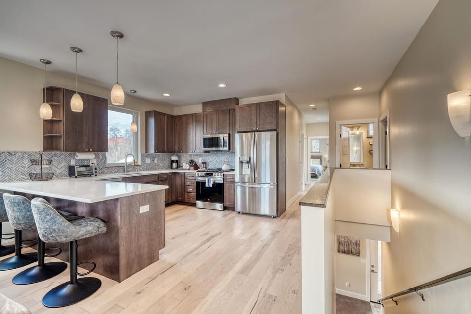 Walk up the stairs to the inviting and spacious second level open concept living and dining area.